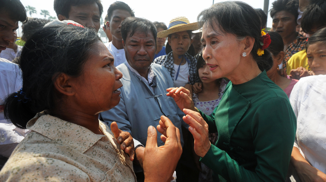 Aung San Suu Kyi (right) faced protesters when she traveled to a village in northern Myanmar on Thursday to discuss a Chinese-backed copper mine project. Suu Kyi, a Nobel laureate and a member of Parliament, urged protesters to support the project, which was the scene of a violent crackdown last year. She said opposing the project would risk hurting the country's economy.