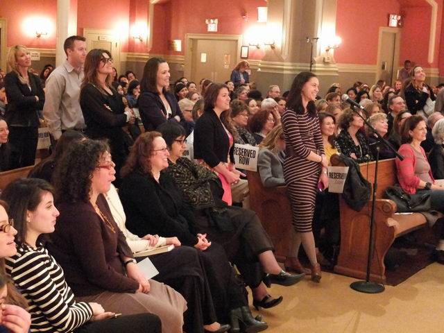 Audience members line up for the Q&amp;A portion of the event. 