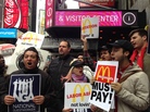 Workers and labor organizers in New York City protest the alleged exploitation of students on J-1 summer work travel visas who worked at a Pennsylvania McDonald's, on Thursday. Workers and labor organizers in New York City protest the alleged exploitation of students on J-1 summer work travel visas who worked at a Pennsylvania McDonald's, on Thursday.