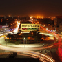 Traffic drives through Tahrir Square in central Baghdad on Wednesday. Ten years after the start of the war, bullet holes still mark buildings, and towers wrecked by U.S. missiles and tank shells have not been fully rebuilt.