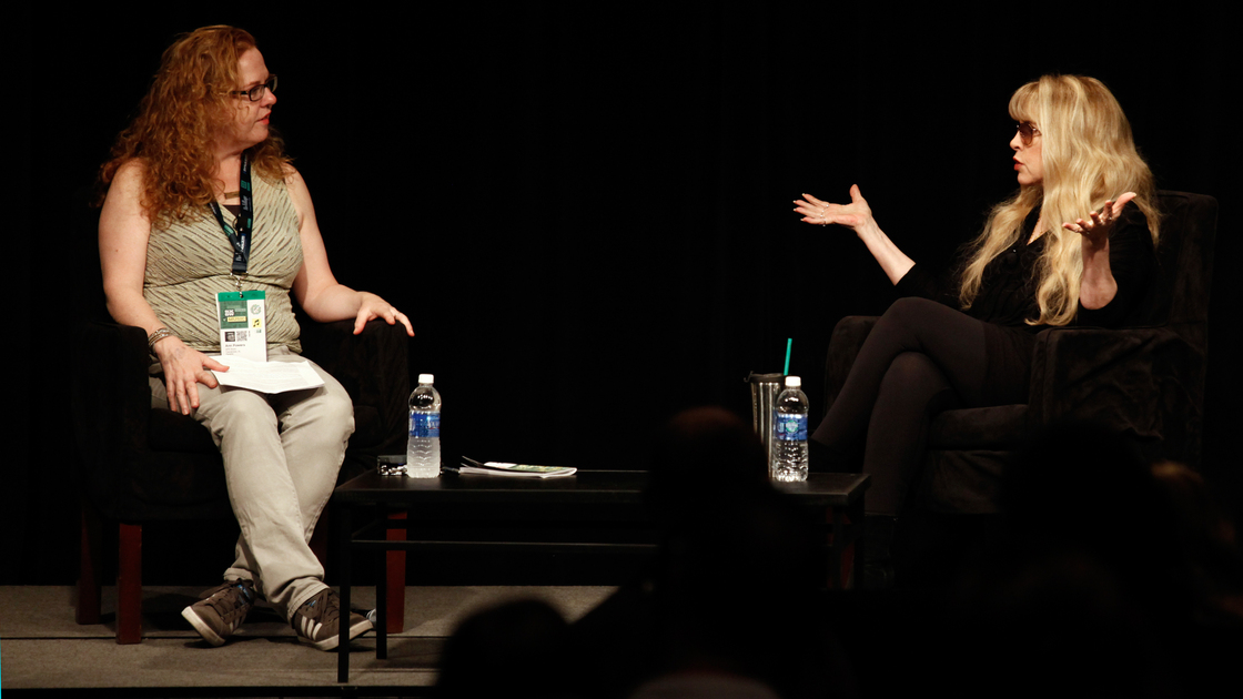 Stevie Nicks (right), speaking in front of a crowd at SXSW in Austin, Texas, told Ann Powers that "a big attitude" was her secret to being taken seriously when she joined Fleetwood Mac.