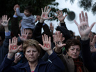 Cypriots protest an EU bailout deal outside the parliament in Nicosia on Monday. A proposed bailout deal would slap a levy on all Cypriot bank savings. Cypriots protest an EU bailout deal outside the parliament in Nicosia on Monday. A proposed bailout deal would slap a levy on all Cypriot bank savings.