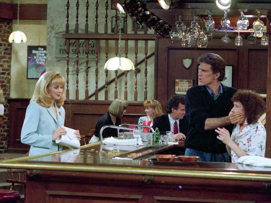 Ted Danson, playing the role of bartender Sam Malone, keeps Rhea Perlman, playing waitress Carla Tortelli, under control as Shelley Long, portraying Diane Chambers, left, returns to the set of Cheers during taping of the final episode in 1993.