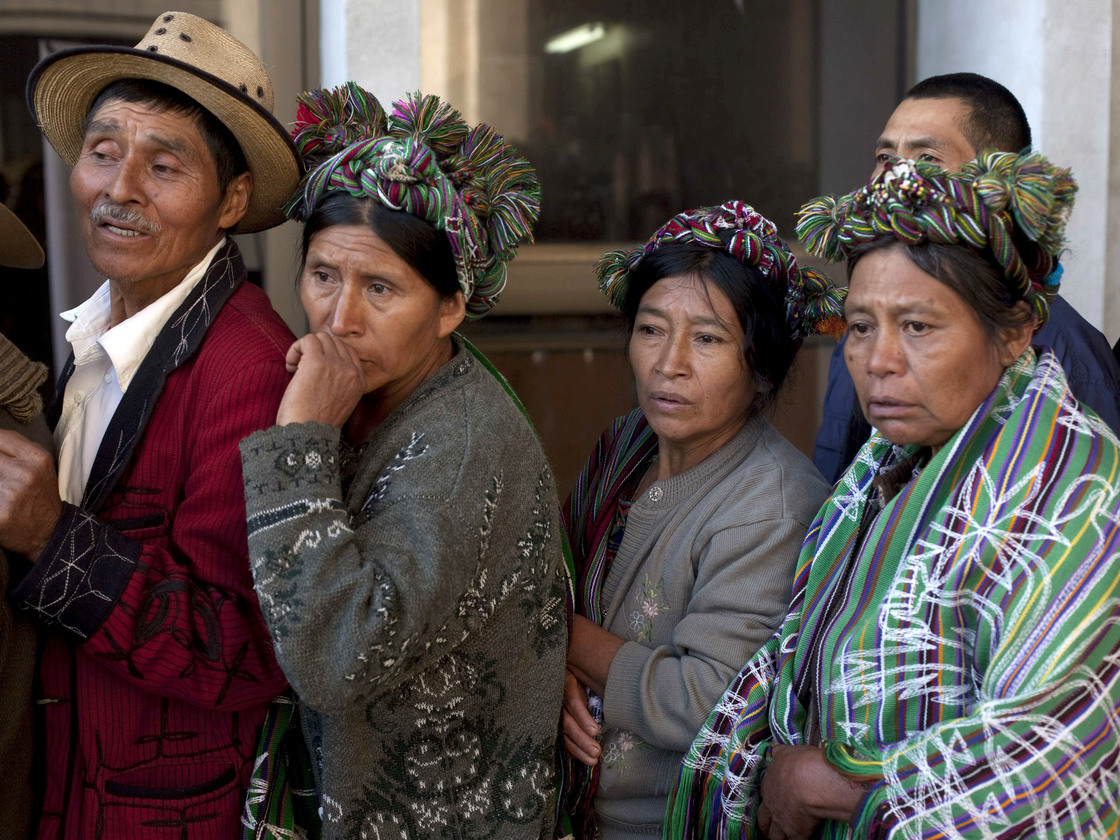 Members of the Ixil ethnic group who lost relatives in a massacre during Guatemala's long civil war wait to enter a courtroom where former ruler Efrain Rios Montt (1982-1983) faces charges of genocide.