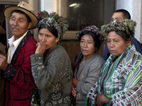 Members of the Ixil ethnic group who lost relatives in a massacre during Guatemala's long civil war wait to enter a courtroom where former ruler Efrain Rios Montt (1982-1983) faces charges of genocide.
