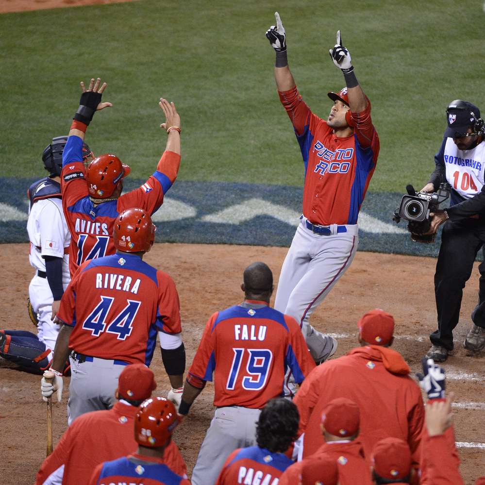 Puerto Rico's Alex Rios celebrated Sunday with teammates after hitting a two-run home run in the seventh inning against Japan in the semi-finals of the World Baseball Classic at AT&T Park in San Francisco.