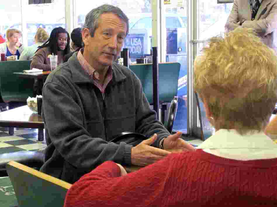 Former South Carolina Gov. Mark Sanford chats with a diner at a restaurant in Charleston, S.C. Sanford is one of 16 Republicans in Tuesday's GOP primary for the special election to fill the vacant 1st Congressional District seat.