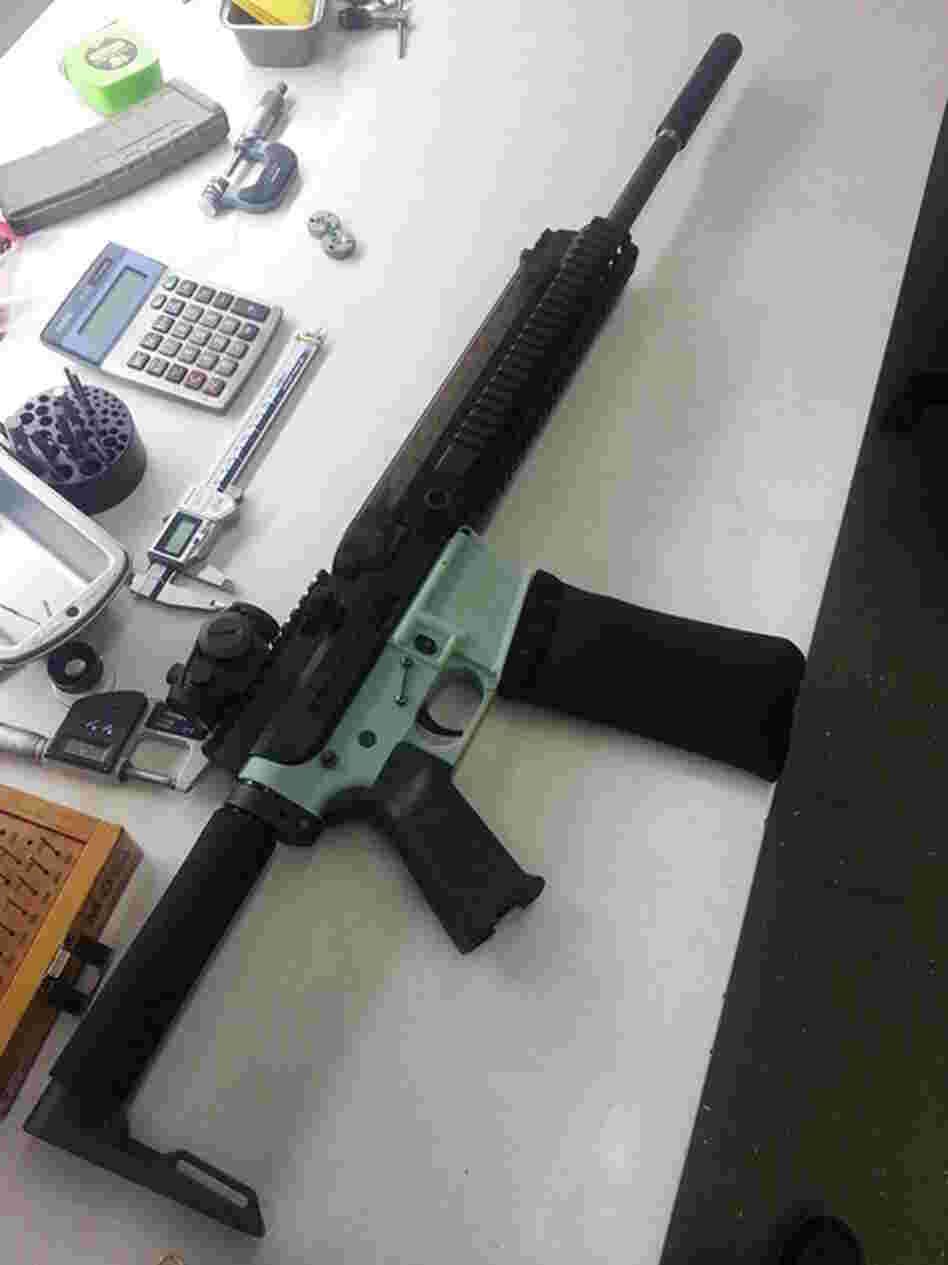 This AR-15 rifle's lower receiver (in soft green color) was produced with a 3-D printer. The 3-D printing industry has criticized the use of the technology for gun part making.