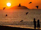 A couple watch the sunrise at Copacabana beach in Rio de Janeiro, Brazil, on Februrary 26, 2013. A couple watch the sunrise at Copacabana beach in Rio de Janeiro, Brazil, on Februrary 26, 2013.