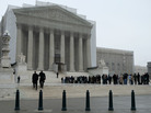 People stand in line outside the U.S. Supreme Court on Monday. People stand in line outside the U.S. Supreme Court on Monday.