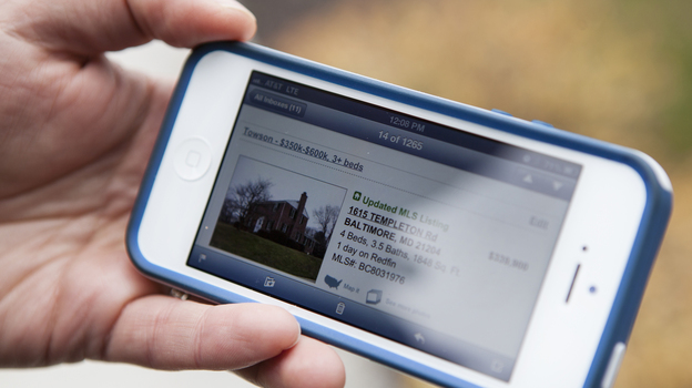 Bove gets text alerts of new homes coming on the market. (Lauren Rock for NPR)