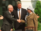 With President Clinton presiding, Israeli Prime Minister Yitzhak Rabin (left) and Palestinian leader Yasser Arafat signed an interim peace accord at the White House in 1993. Twenty years later, President Obama is heading to the region with peace efforts in the deep freeze. With President Clinton presiding, Israeli Prime Minister Yitzhak Rabin (left) and Palestinian leader Yasser Arafat signed an interim peace accord at the White House in 1993. Twenty years later, President Obama is heading to the region with peace efforts in the deep freeze.