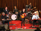 Natalie Maines (center) at Central Presbyterian Church in Austin, Texas during the SXSW Music Festival. Maines's band included her father, Lloyd Maines (seated left) and Ben Harper (seated right). Natalie Maines (center) at Central Presbyterian Church in Austin, Texas during the SXSW Music Festival. Maines's band included her father, Lloyd Maines (seated left) and Ben Harper (seated right).