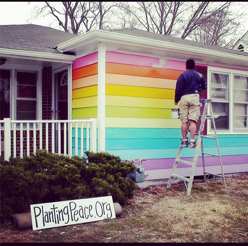 Planting Peace is painting their house across the Westboro Baptist Church in Topeka with the colors of the gay pride rainbow.