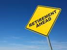 A yellow sign reads "Retirement Ahead." A yellow sign reads "Retirement Ahead."