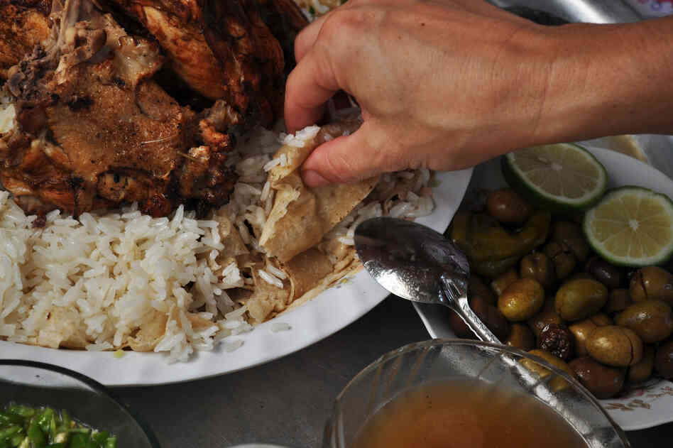 Fatta, a meal of buttery rice served with roasted meat and griddle bread soaked in broth, is often made for guests.