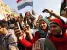 Egyptians use their mobile phones to record celebrations in Cairo's Tahrir Square, the epicenter of the popular revolt that drove Hosni Mubarak from power in 2011. Twitter was often used to record happenings during the Arab Spring.