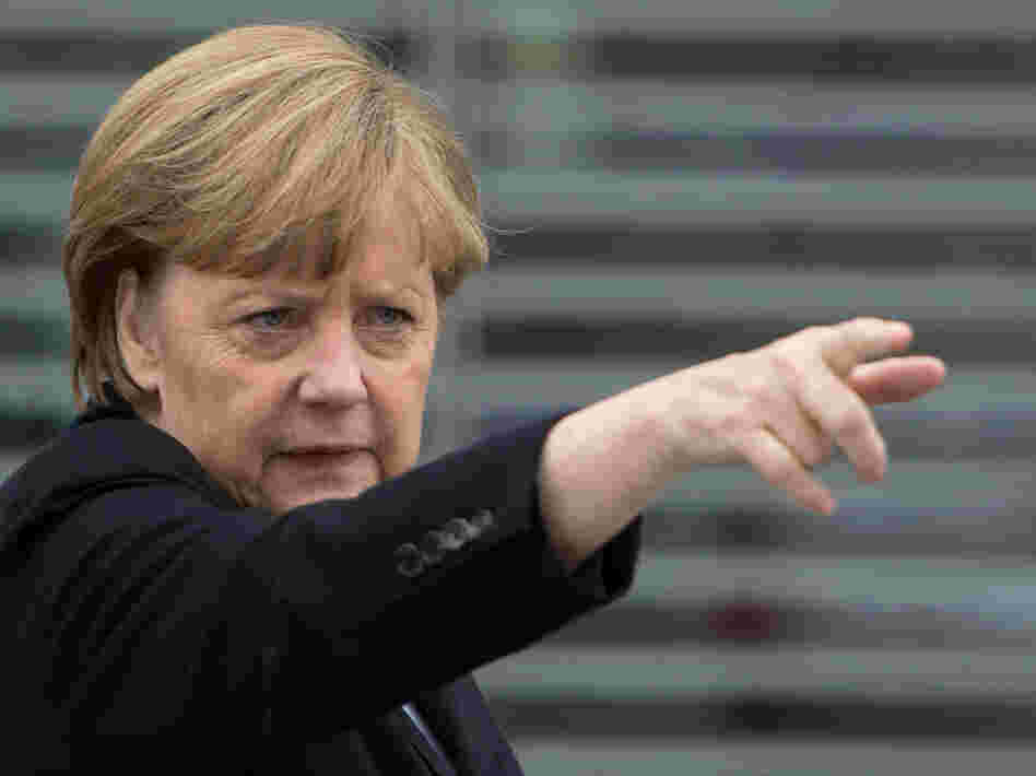 German Chancellor Angela Merkel gestures as she leaves a parliamentary session on Wednesday in Berlin.