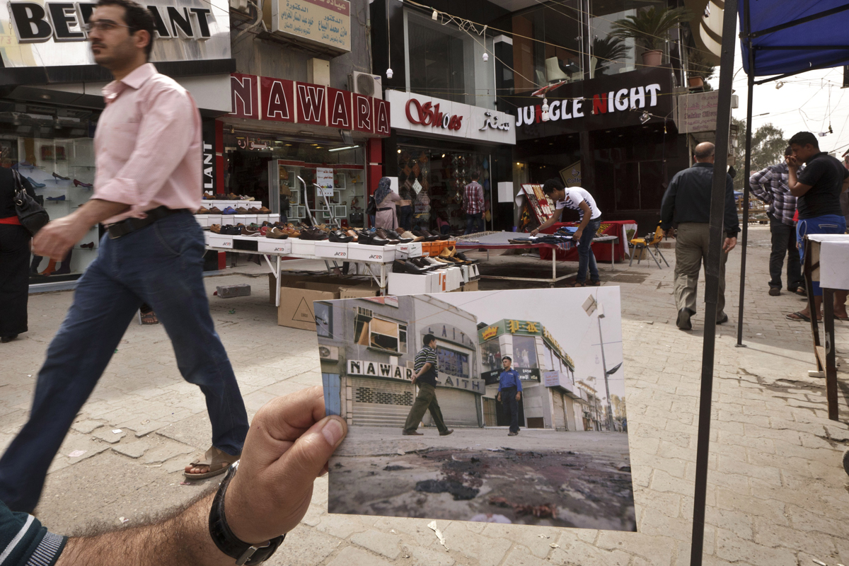 Today, shoppers pass through Baghdad's busy Karrada shopping district. The 2008 photo, taken by Hadi Mizban, shows the scene after a bombing that killed 22 people. Bloody attacks launched by terrorists who thrived in the post-invasion chaos are still frequent, although less so than a few years back.
