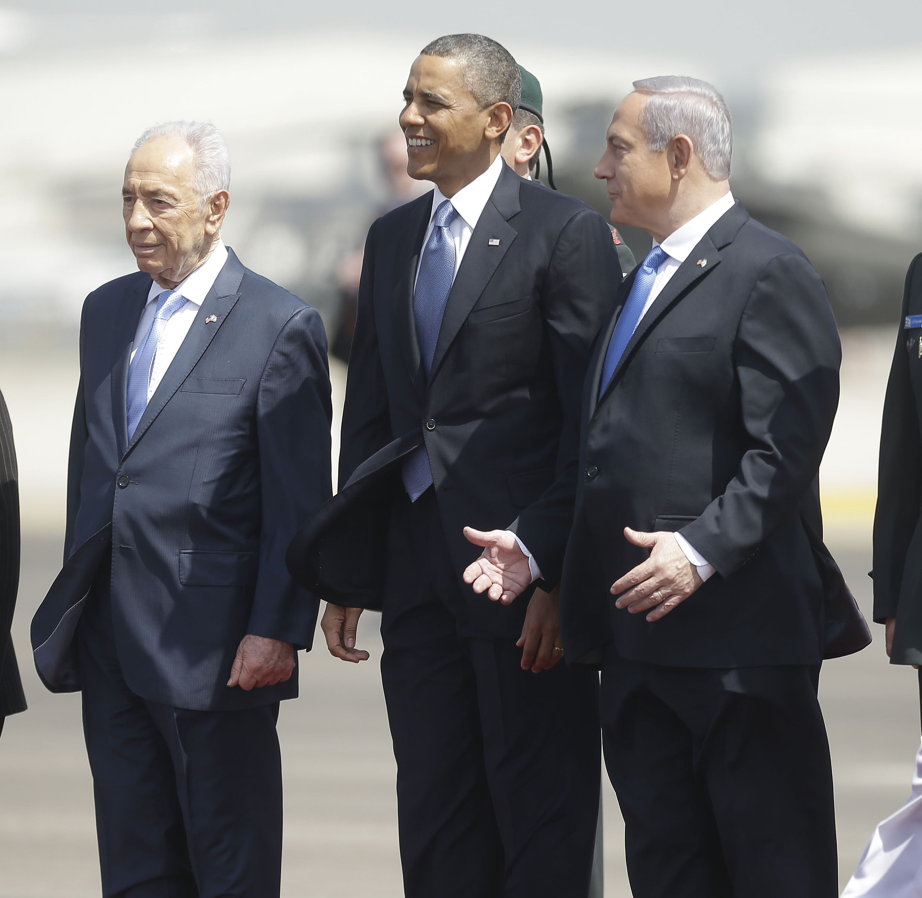 President Barack Obama is greeted by Israeli President Shimon Peres, left, and Israeli Prime Minister Benjamin Netanyahu upon his arrival ceremony at Ben Gurion International Airport in Tel Aviv, Israel, on Wednesday.