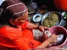 Fatema Qaadan prepares fatta, a meal of buttery rice and griddle bread served with roasted meat. Fatema Qaadan prepares fatta, a meal of buttery rice and griddle bread served with roasted meat.