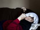 A towel covers the face of a man in a geriatric day care facility of the German Red Cross at Villa Albrecht in Berlin. A towel covers the face of a man in a geriatric day care facility of the German Red Cross at Villa Albrecht in Berlin.