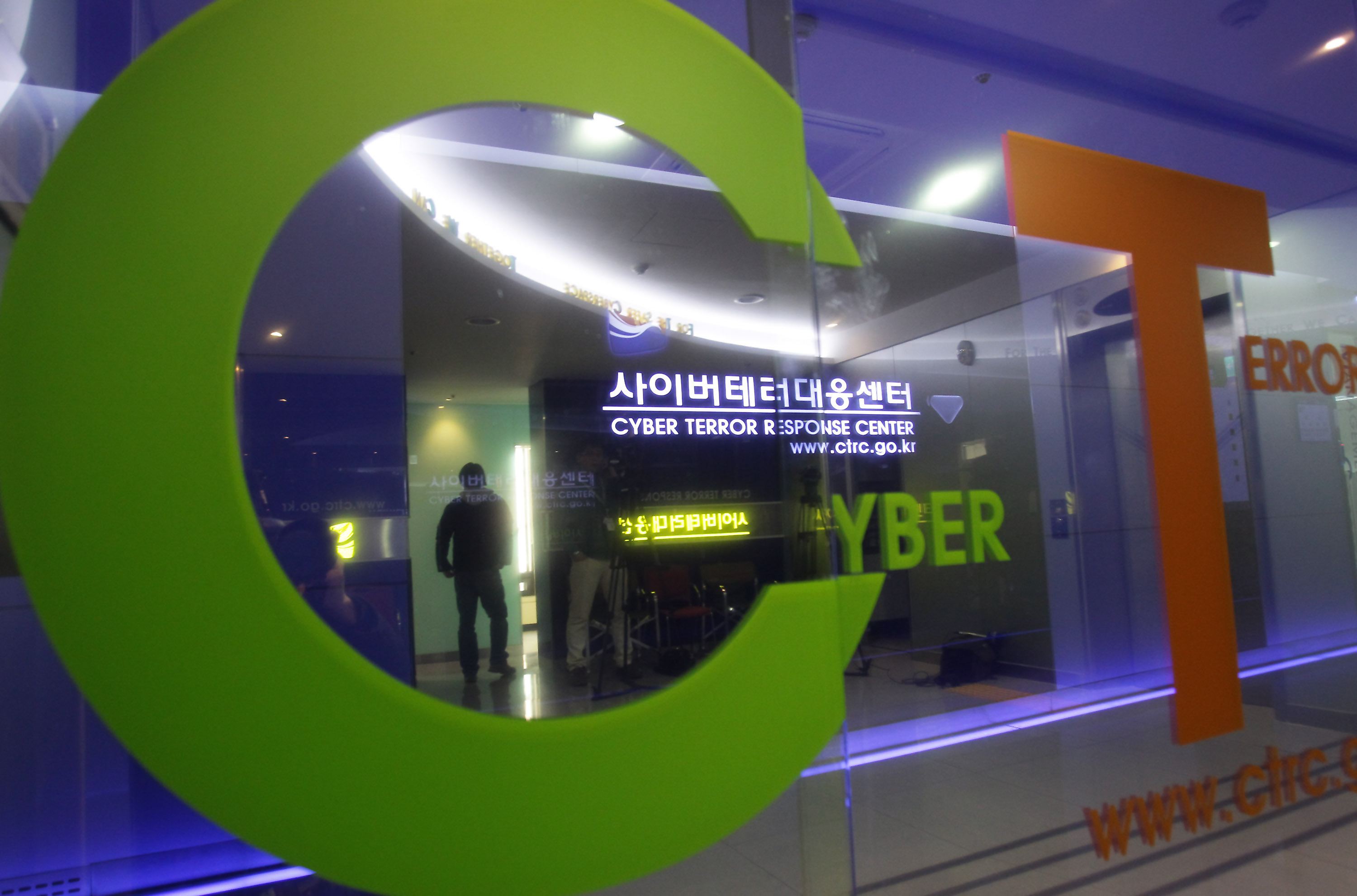A man walks past the Cyber Terror Response Center at National Police Agency in Seoul, South Korea.