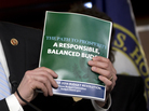 House Budget Committee Chairman Rep. Paul Ryan, R-Wis., holds a copy of his budget plan during a news conference last week. On Thursday, the Republican-controlled House narrowly passed the measure. The Senate is not expected to follow suit. House Budget Committee Chairman Rep. Paul Ryan, R-Wis., holds a copy of his budget plan during a news conference last week. On Thursday, the Republican-controlled House narrowly passed the measure. The Senate is not expected to follow suit.