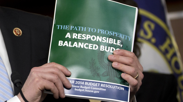 House Budget Committee Chairman Rep. Paul Ryan, R-Wis., holds a copy of his budget plan during a news conference last week. On Thursday, the Republican-controlled House narrowly passed the measure. The Senate is not expected to follow suit.