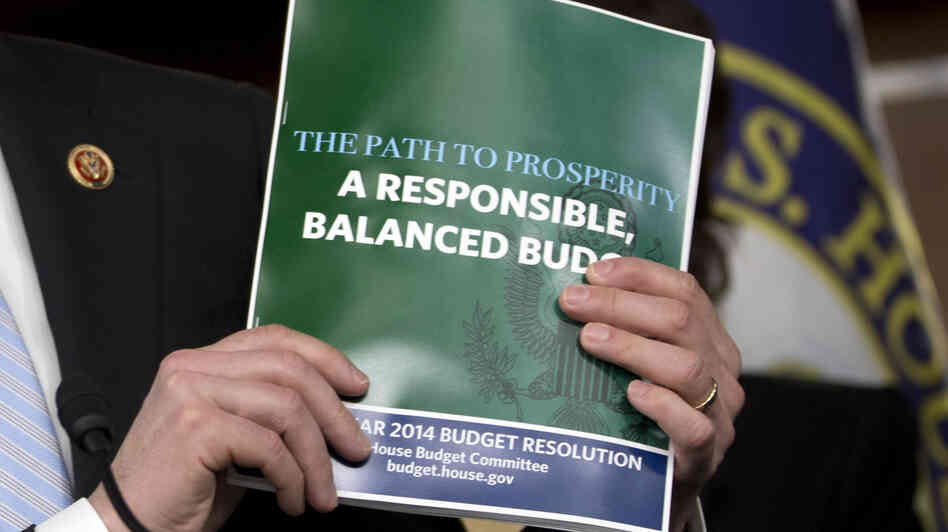 House Budget Committee Chairman Rep. Paul Ryan, R-Wis., holds a copy of his budget plan during a news conference last week. On Thursday, the Republican-controlled House narrowly passed the measure. The Senate is not expected to follow suit.
