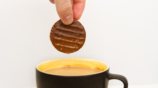 Just a little plunge into hot tea makes a chocolate-covered biscuit release its flavor more quickly in your mouth.