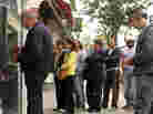 People wait in line to use the ATM at a bank in the Cypriot capital Nicosia. People wait in line to use the ATM at a bank in the Cypriot capital Nicosia.