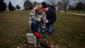 Will Piper and Annette Pacas visit the grave of Annette's son, Alex, at Oak Hill Cemetery in Mount Carroll, Ill. Piper says he hopes to raise money to replace the makeshift, plastic marker with a permanent gravestone.