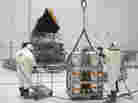 Technicians prepare the Planck satellite for hydrazine fueling in April 2009. Technicians prepare the Planck satellite for hydrazine fueling in April 2009.
