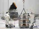 Technicians prepare the Planck satellite for hydrazine fueling in April 2009. Technicians prepare the Planck satellite for hydrazine fueling in April 2009.
