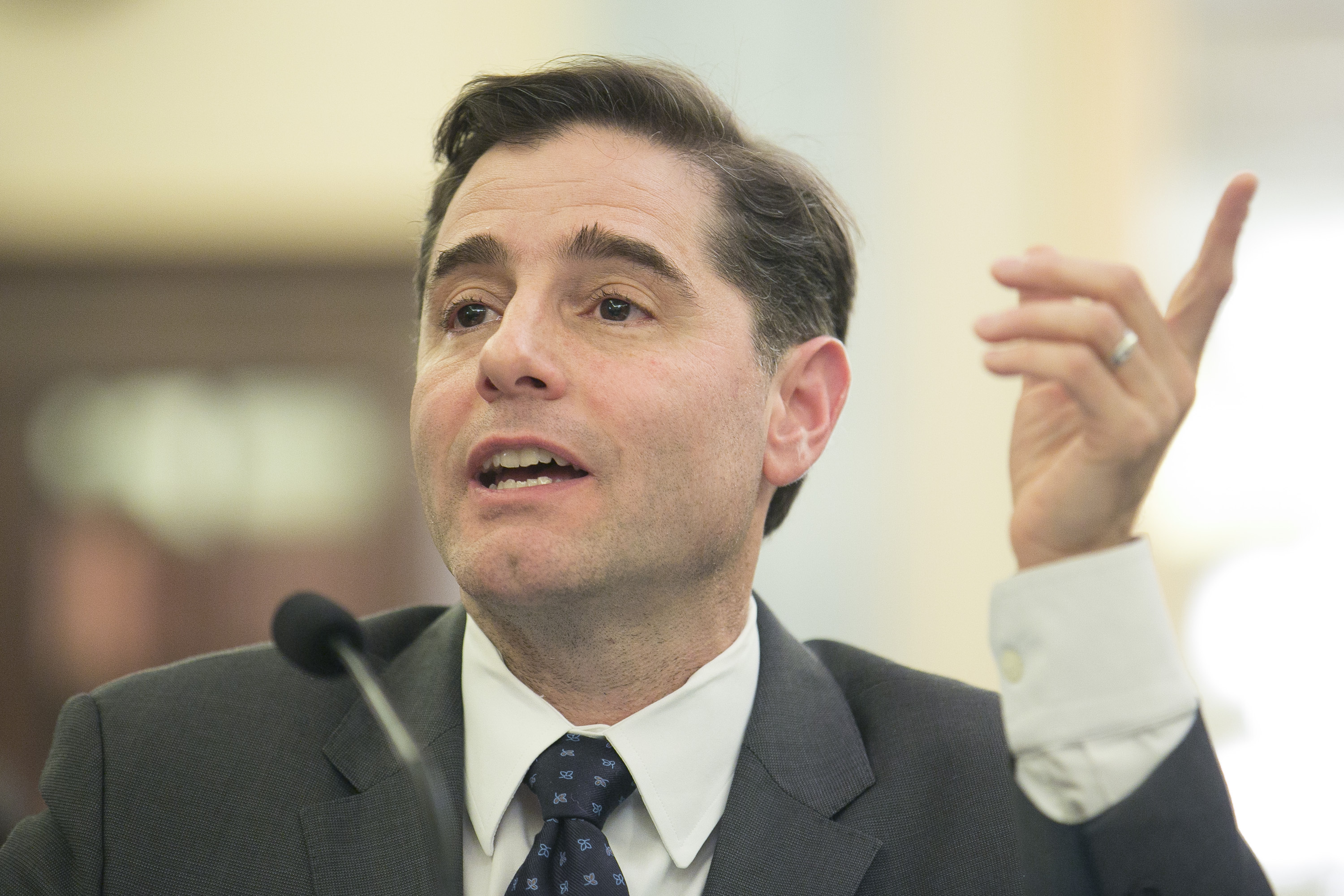 Federal Communications Commission Chairman Julius Genachowski testifies before a Senate committee in March of 2013.