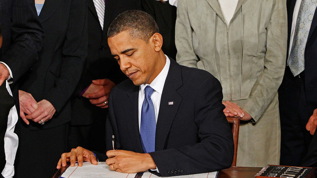 President Obama signs the Affordable Care Act at the White House on March 23, 2010. (Getty Images)