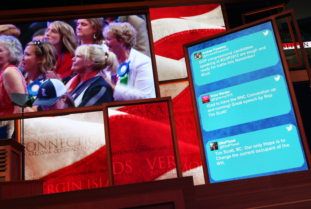 Tweets from GOP supporters scroll along the side of a large-screen display at the Republican National Convention in Tampa, Fla., on Aug. 28, 2012.