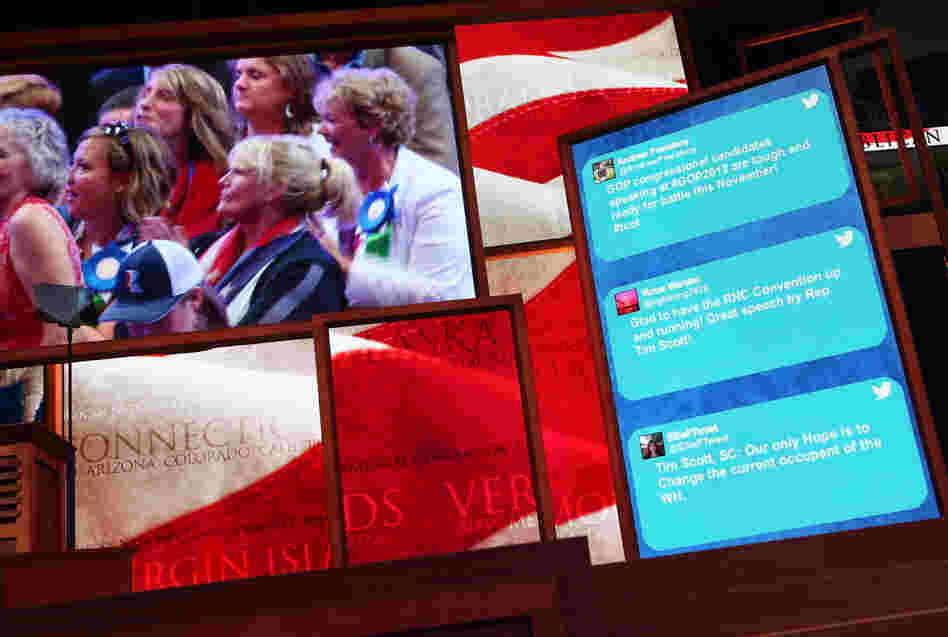 Tweets from GOP supporters scroll along the side of a large-screen display at the Republican National Convention in Tampa, Fla., on Aug. 28, 2012.