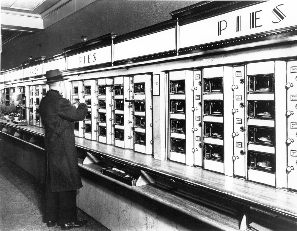 A customer selects his food at a Horn & Hardart's Automat in New York City.