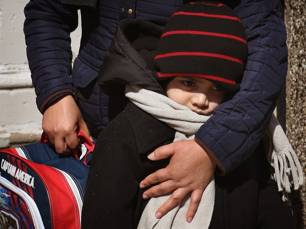 Juan Carlos Ordonez, 5, gets a hug from his mother at Chicago's Jean De Lafayette Elementary School, one of 54 schools slated for closure. Ordonez attends a special education program for students with autism or severe and profound disabilities. About 170 of Lafayette's 480 students are in the program.