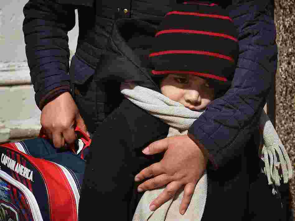 Juan Carlos Ordonez, 5, gets a hug from his mother at Chicago's Jean De Lafayette Elementary School, one of 54 schools slated for closure. Ordonez attends a special education program for students with autism or severe and profound disabilities. About 170 of Lafayette's 480 students are in the program.
