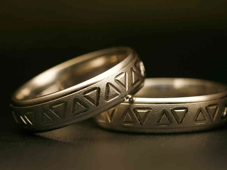 Same-sex wedding rings are engraved with triangles, a symbol of gay pride. Detractors say extending recognition to same-sex couples will weaken a bedrock institution meant to protect women and children.
