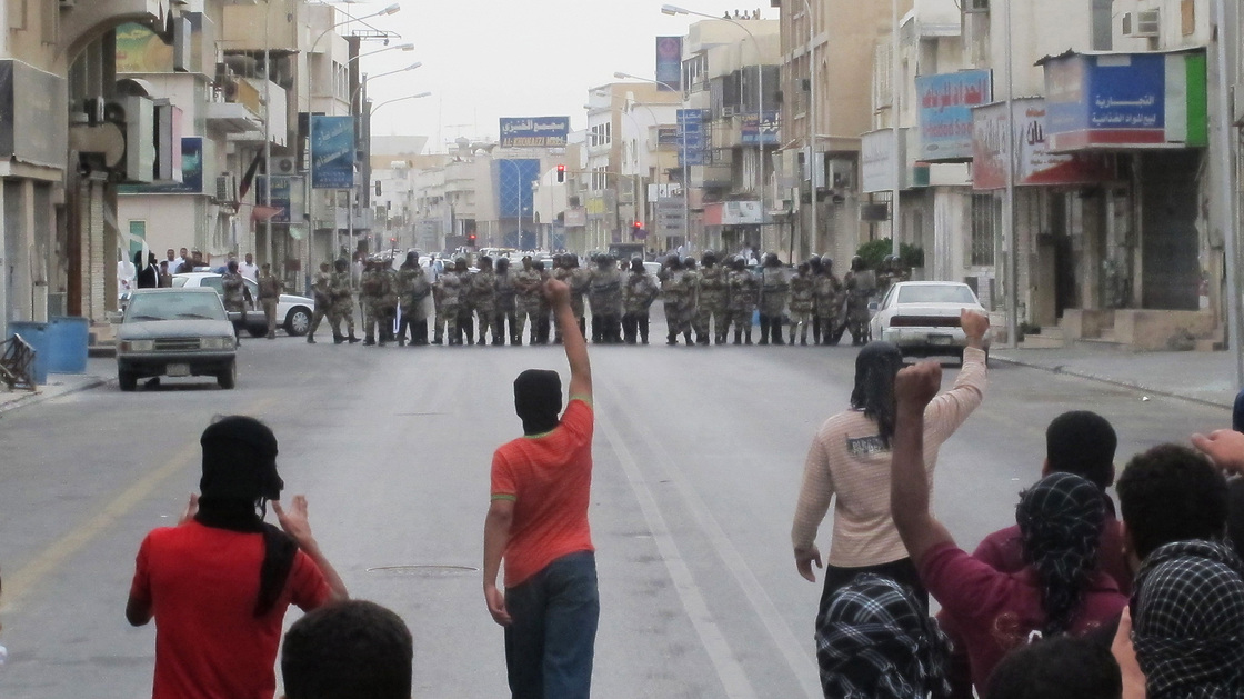 Anti-riot police face off with protesters in Saudi Arabia's eastern city of Qatif on March 11, 2011. Despite bans on the demonstrations, Shiite Muslims in the eastern part of the country have continued to stage protests, demanding political changes.