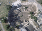 In the spring of 1981, a woman's house and part of a car dealership were swallowed by a sinkhole in Winter Park, Fla.