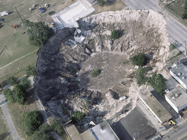 In the spring of 1981, a woman's house and part of a car dealership were swallowed by a sinkhole in Winter Park, Fla.