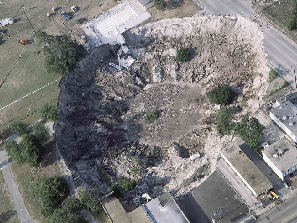 In the spring of 1981, a woman's house and part of a car dealership were swallowed by a sinkhole in Winter Park, Fla.