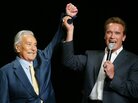 Arnold Schwarzenegger raises the arm of Joe Weider, the creator of the Mr. Olympia Bodybuilding competition, during the 39th annual Mr. Olympia event in 2003. Weider died Saturday at 93. Arnold Schwarzenegger raises the arm of Joe Weider, the creator of the Mr. Olympia Bodybuilding competition, during the 39th annual Mr. Olympia event in 2003. Weider died Saturday at 93.