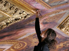 Restorer Nicoletta Rinaldi works on the ceiling of the Hall of Mirrors at the Versailles Palace, west of Paris, in 2007. Restorer Nicoletta Rinaldi works on the ceiling of the Hall of Mirrors at the Versailles Palace, west of Paris, in 2007.