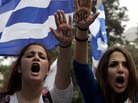 Students in the Cypriot capital, Nicosia, protest against austerity measures in front of the presidential residence. Students in the Cypriot capital, Nicosia, protest against austerity measures in front of the presidential residence.